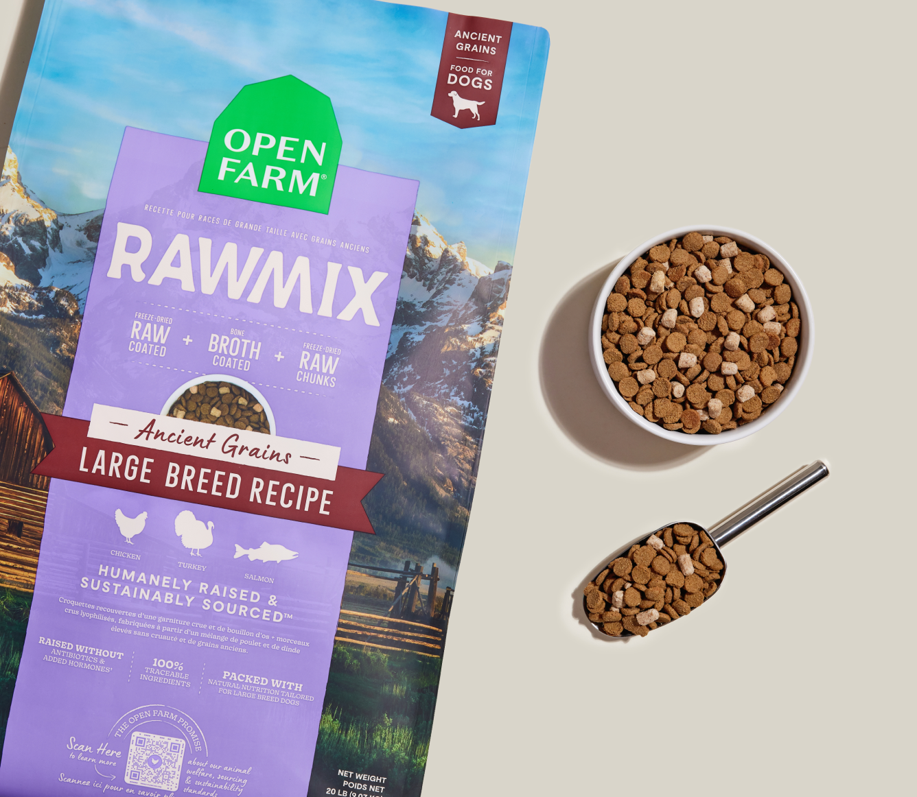 Open Farm Rawmix dog food package with mountain and cabin design on a beige background