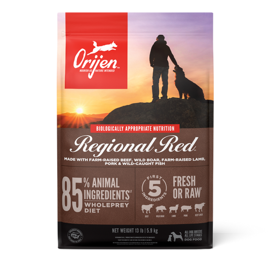 Orijen Regional Red dog food package with a silhouette of a person and dog on a mountain at sunset.