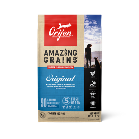 Orijen dog food package with a person and dog on a beach